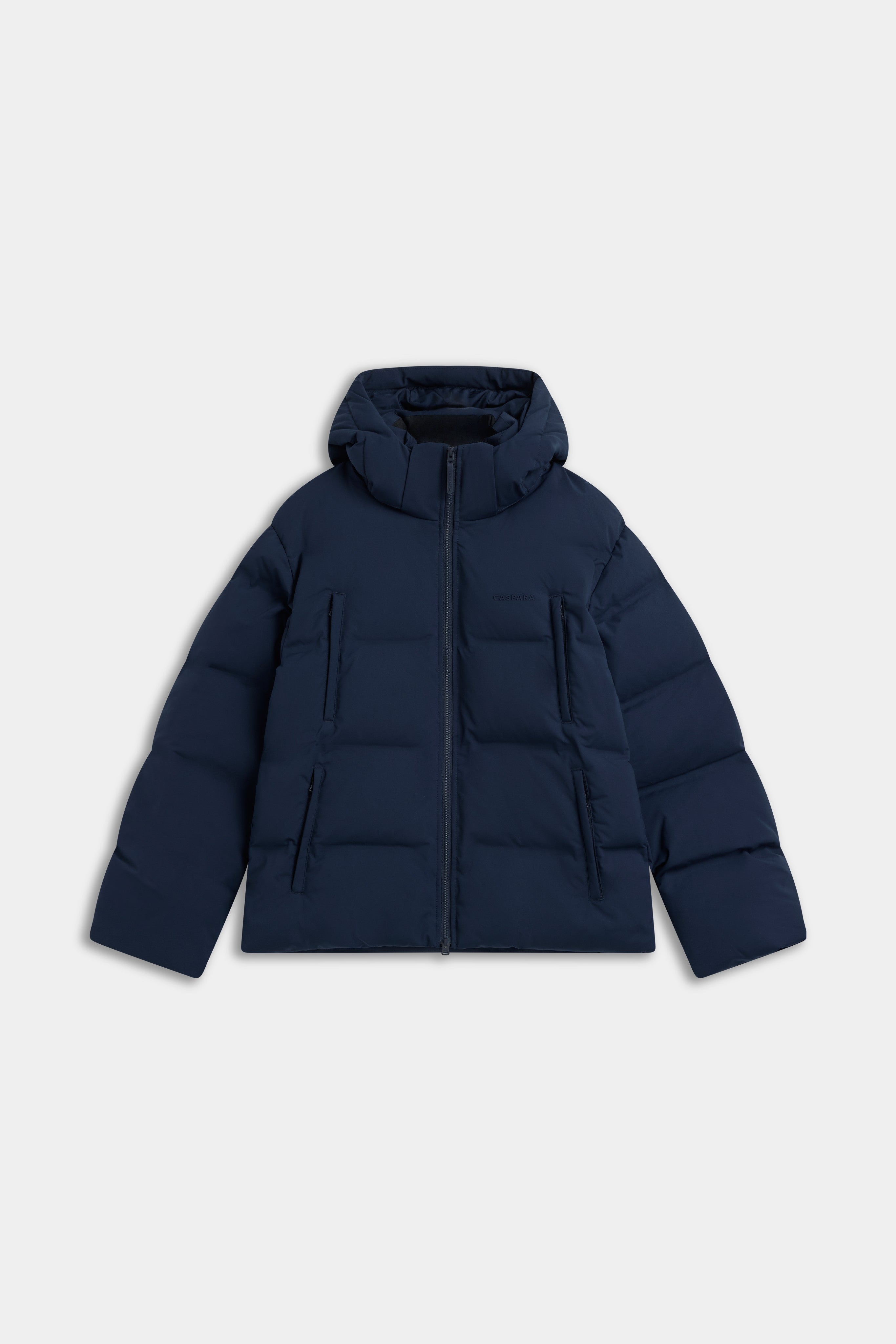 Front view of the navy CASPARA Boreal puffer jacket with attached hood.